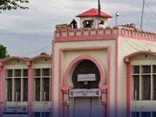 "An exterior view of Adiala Jail Rawalpindi building with security post on top"