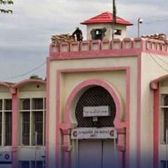 "An exterior view of Adiala Jail Rawalpindi building with security post on top"