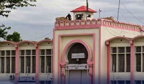 "An exterior view of Adiala Jail Rawalpindi building with security post on top"