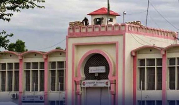 "An exterior view of Adiala Jail Rawalpindi building with security post on top"